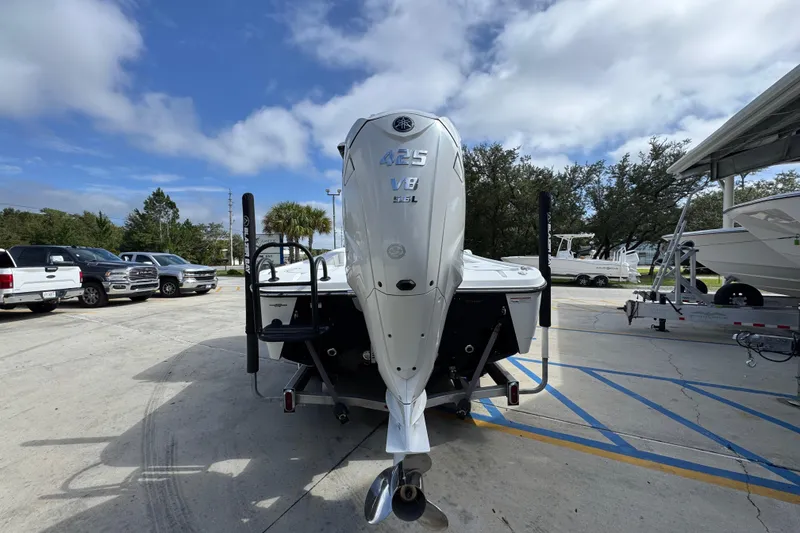 Slide: The Image of 2021 Blazer Bay 2700 Hybrid boat with powerful 425 V8 engine in a parking lot. - 12