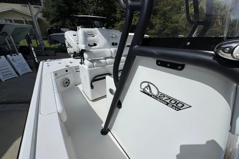 Slide: The Image of 2021 Blazer Bay 2700 Hybrid boat interior with seating and logo detail. - 22