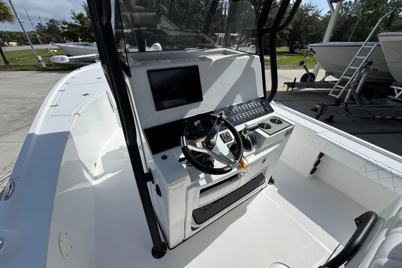 Slide: The Image of 2021 Blazer Bay 2700 Hybrid boat cockpit with steering wheel and control panel. - 26