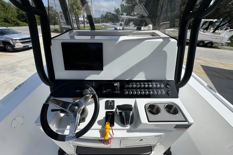 Slide: The Image of 2021 Blazer Bay 2700 Hybrid boat console with steering wheel and control panel. - 27