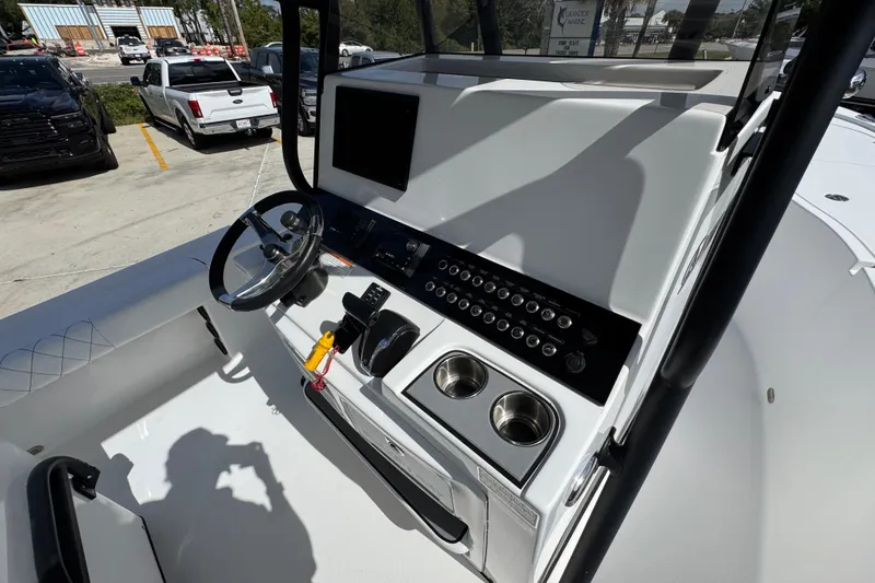 Slide: The Image of 2021 Blazer Bay 2700 Hybrid boat console with steering wheel and control panel. - 29