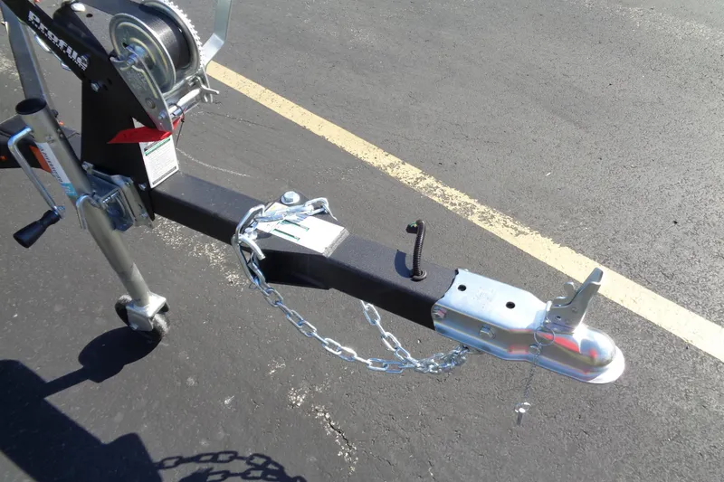Slide: The Image of Trailer hitch and winch of a 2026 Lund 1650 Rebel Tiller boat. - 11