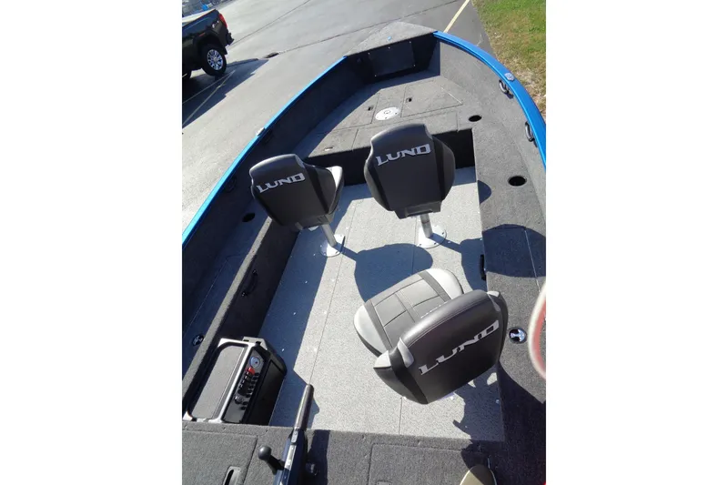 Slide: The Image of 2026 Lund 1650 Rebel Tiller boat interior with three seats and spacious layout. - 7