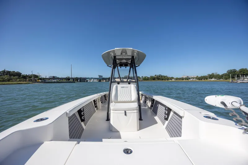 Slide: The Image of 2023 Pathfinder 2700 Open boat on calm water under clear blue sky. - 13