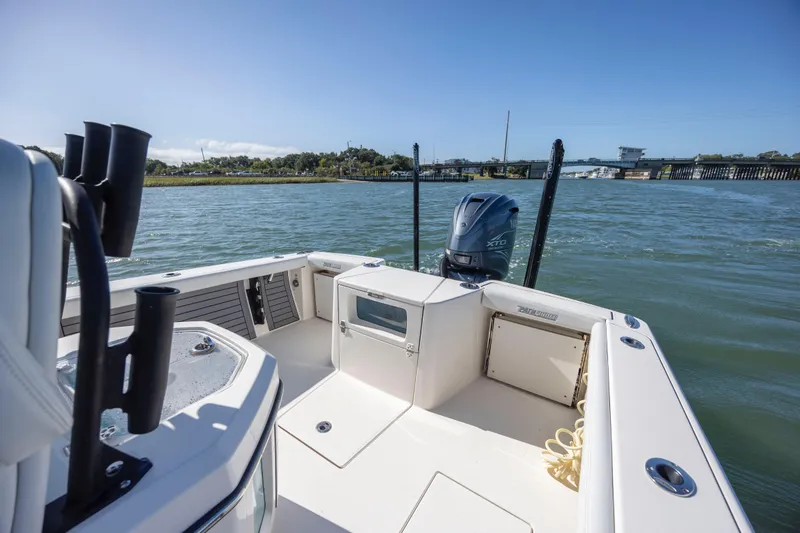 Slide: The Image of 2023 Pathfinder 2700 Open boat on water, featuring spacious deck and powerful engine. - 17