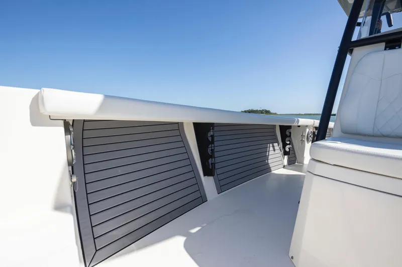 Slide: The Image of 2023 Pathfinder 2700 Open boat interior with sleek seating and storage compartments. - 19