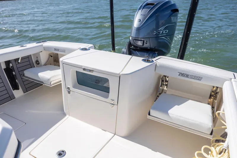 Slide: The Image of 2023 Pathfinder 2700 Open boat interior with Yamaha engine on water. - 27
