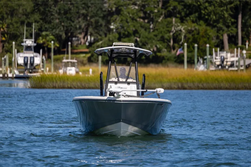 Slide: The Image of 2023 Pathfinder 2700 Open boat cruising on a serene waterway. - 4