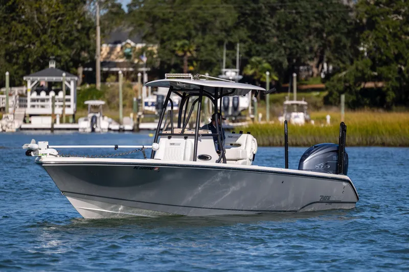 Slide: The Image of 2023 Pathfinder 2700 Open boat cruising on a scenic waterway. - 5