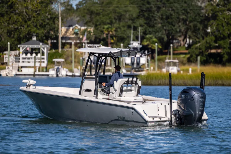 Slide: The Image of 2023 Pathfinder 2700 Open boat cruising on a scenic waterway. - 6