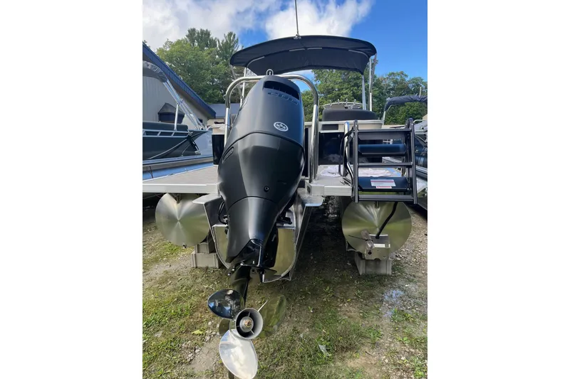 Slide: The Image of 2026 Avalon 25 LSZ Quad Lounger pontoon boat with powerful outboard motor. - 9