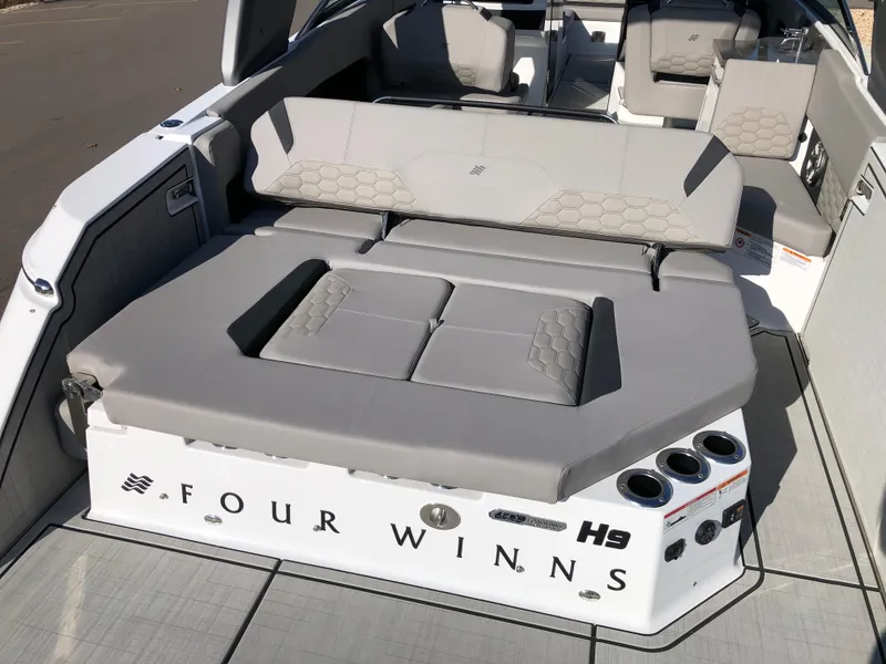 Slide: The Image of 2025 Four Winns H9 boat interior with luxurious seating and modern design. - 4