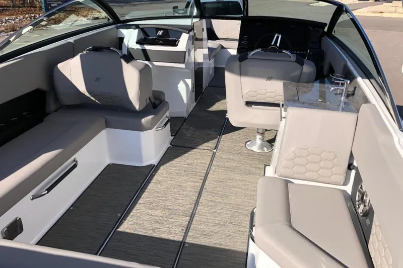 Slide: The Image of 2025 Four Winns H9 boat interior with modern seating and sleek design. - 5