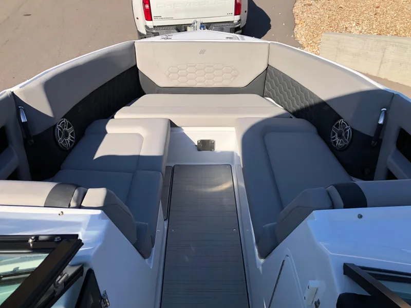 Slide: The Image of 2025 Four Winns H9 boat interior with gray seating and modern design. - 9