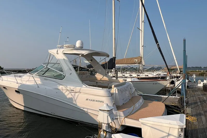 The Image of 2008 Four Winns 378 Vista yacht docked at marina, surrounded by sailboats. - 1