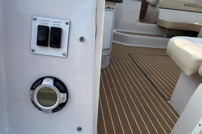 Slide: The Image of Interior of 2008 Four Winns 378 Vista boat with control panel and seating area. - 15