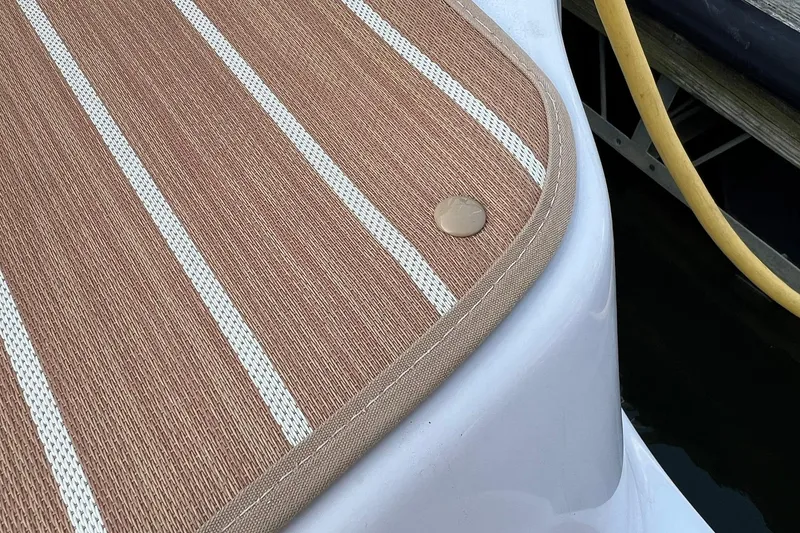 Slide: The Image of 2008 Four Winns 378 Vista boat deck with striped mat and button detail. - 16