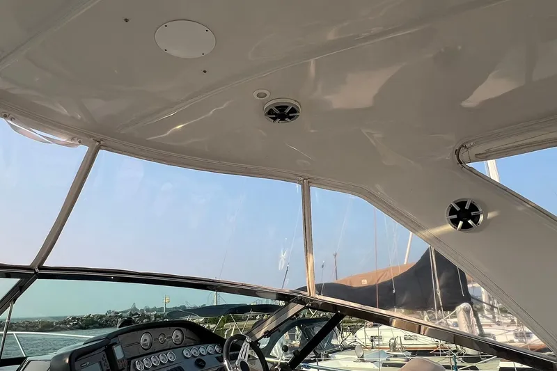 Slide: The Image of 2008 Four Winns 378 Vista boat interior with dashboard and clear canopy view. - 19