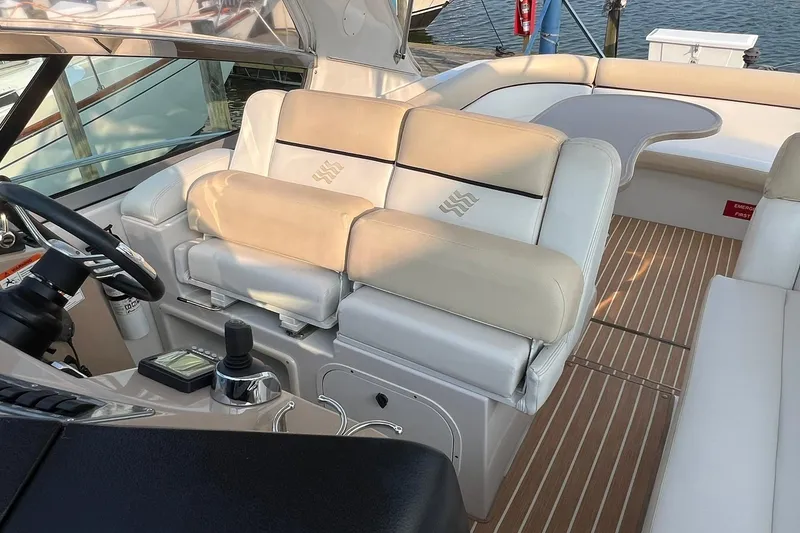 Slide: The Image of 2008 Four Winns 378 Vista boat interior with beige seating and wooden flooring. - 24