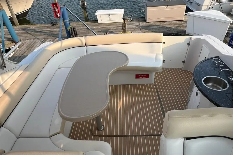 Slide: The Image of 2008 Four Winns 378 Vista boat interior with seating, table, and kitchenette. - 26