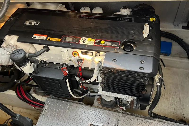 Slide: The Image of Engine compartment of a 2008 Four Winns 378 Vista boat, featuring a Volvo Penta engine. - 32