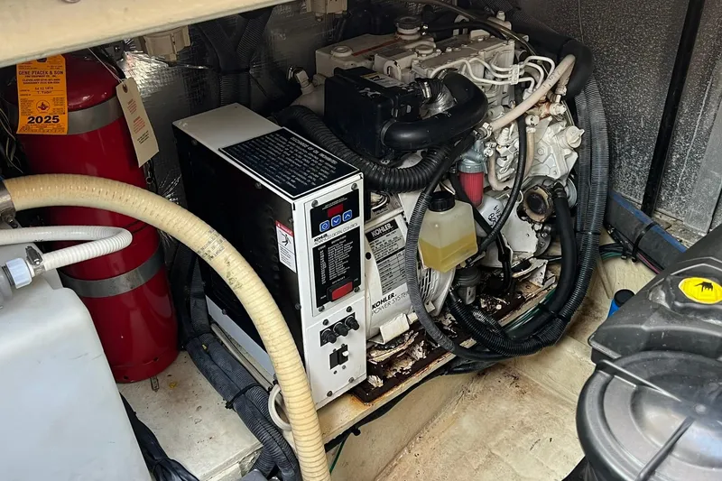 Slide: The Image of Engine room of 2008 Four Winns 378 Vista with Kohler generator and fire extinguisher. - 35