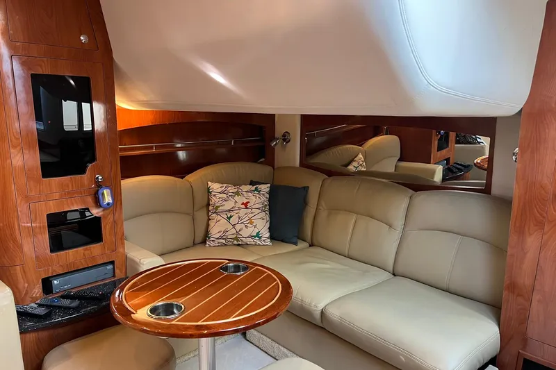 Slide: The Image of Luxurious interior of 2008 Four Winns 378 Vista yacht with beige seating and wooden accents. - 46