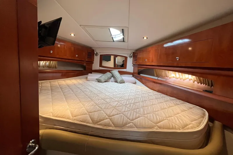 Slide: The Image of Luxurious cabin interior of 2008 Four Winns 378 Vista yacht with cozy bedding. - 51