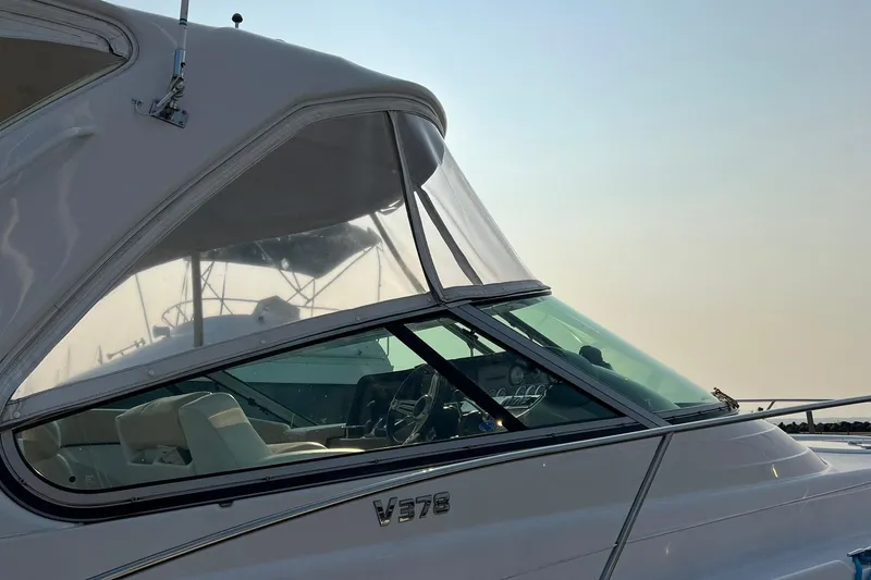 Slide: The Image of 2008 Four Winns 378 Vista boat with sleek design and clear canopy. - 6