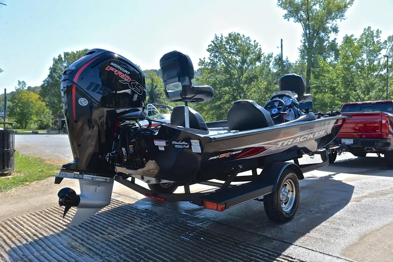 Slide: The Image of 2023 Bass Tracker PRO TEAM 190 boat on trailer with Mercury engine. - 14