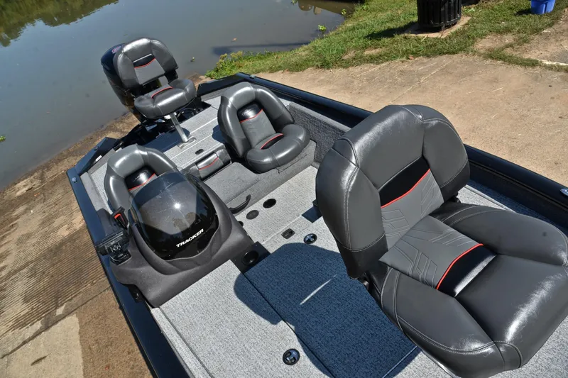 Slide: The Image of 2023 Bass Tracker PRO TEAM 190 boat interior with sleek seating and modern design. - 25