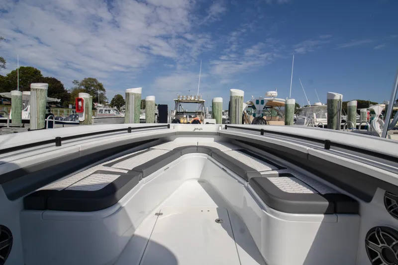 Slide: The Image of 2025 Yellowfin 32 Offshore boat interior at marina under blue sky. - 4