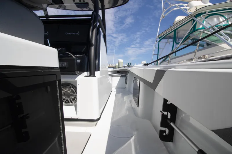 Slide: The Image of 2025 Yellowfin 32 Offshore boat deck with modern equipment and clear blue sky. - 5