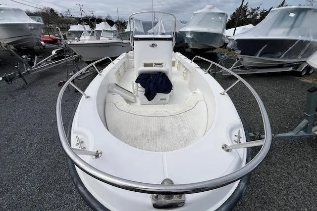 Slide: The Image of 2005 Boston Whaler 190 Nantucket boat on trailer, surrounded by other boats. - 9