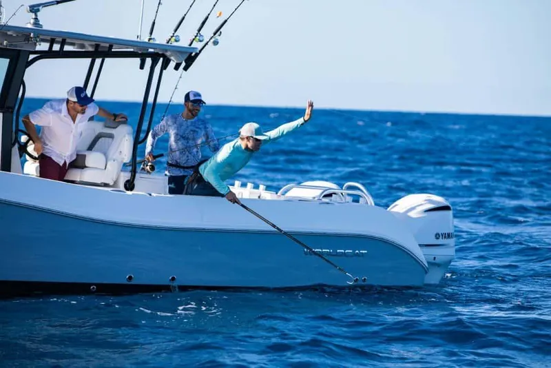 Slide: The Image of 2026 World Cat 325 CC boat interior with luxurious seating and modern steering wheel. - 8