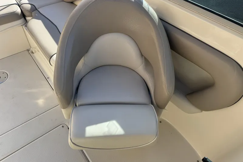 Slide: The Image of 2005 Sea Ray 240 Sundeck boat seat, beige upholstery, comfortable design. - 11