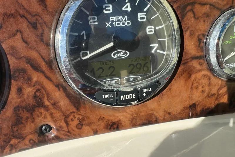 Slide: The Image of Close-up of 2005 Sea Ray 240 Sundeck dashboard with RPM gauge and digital display. - 17