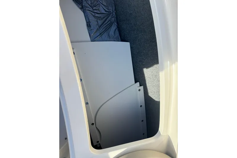 Slide: The Image of Storage compartment of a 2005 Sea Ray 240 Sundeck boat interior. - 19