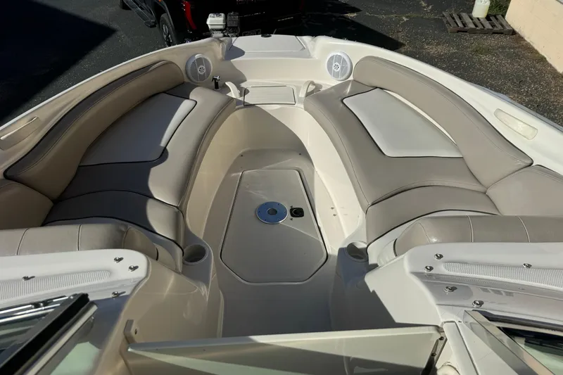 Slide: The Image of 2005 Sea Ray 240 Sundeck interior with spacious seating and modern design. - 7