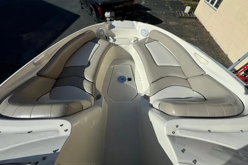 Slide: The Image of 2005 Sea Ray 240 Sundeck interior with spacious seating and sleek design. - 9