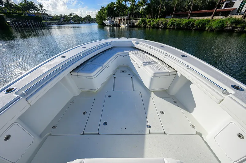 Slide: The Image of 2021 Yellowfin 39 Offshore boat interior with seating, on a scenic waterway. - 26