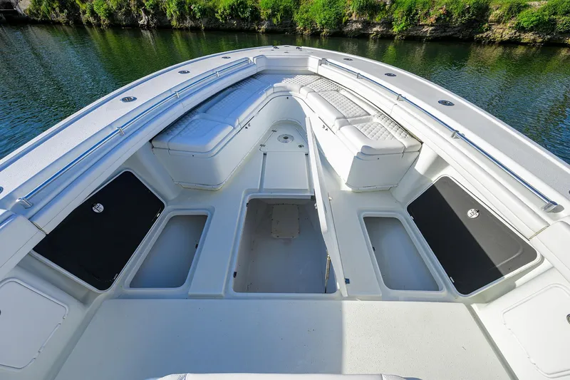 Slide: The Image of 2021 Yellowfin 39 Offshore boat interior with spacious seating and storage compartments. - 27