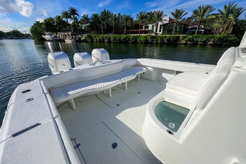 Slide: The Image of 2021 Yellowfin 39 Offshore boat with spacious deck and triple outboard engines. - 32