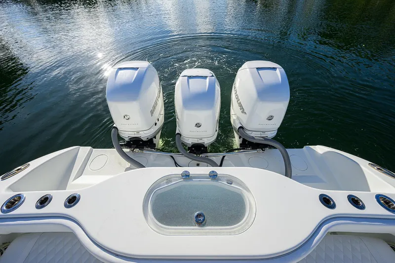 Slide: The Image of 2021 Yellowfin 39 Offshore boat with triple Mercury outboard engines on water. - 36