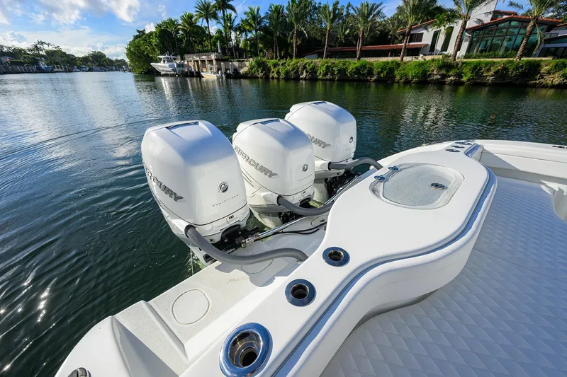 Slide: The Image of 2021 Yellowfin 39 Offshore boat with triple Mercury engines on a scenic waterway. - 37