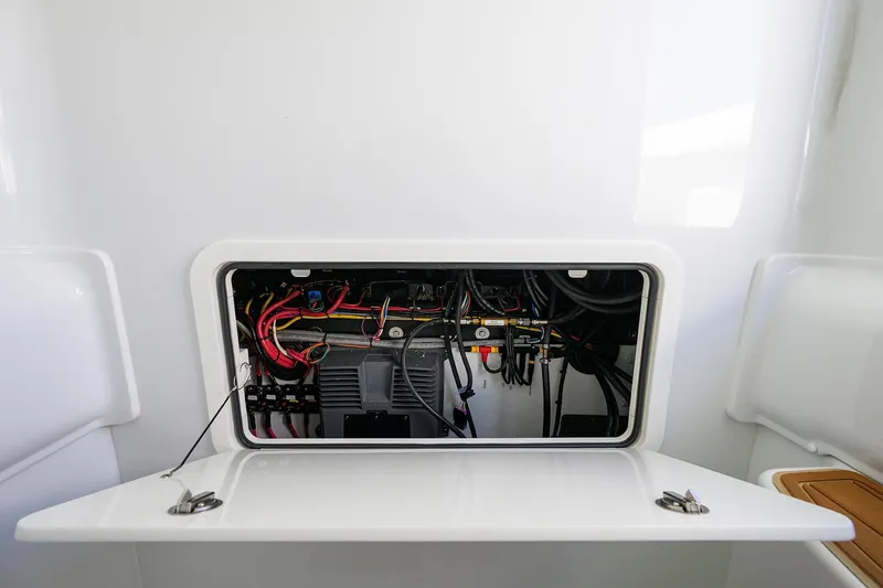 Slide: The Image of Electrical compartment of 2021 Yellowfin 39 Offshore boat, showcasing wiring and components. - 46