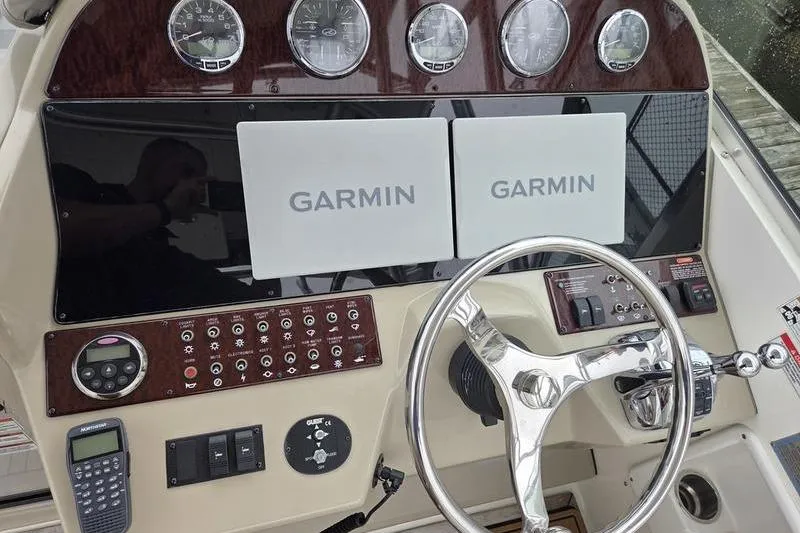 Slide: The Image of Dashboard of 2008 Sea Ray 290 Amberjack with Garmin navigation system and controls. - 18