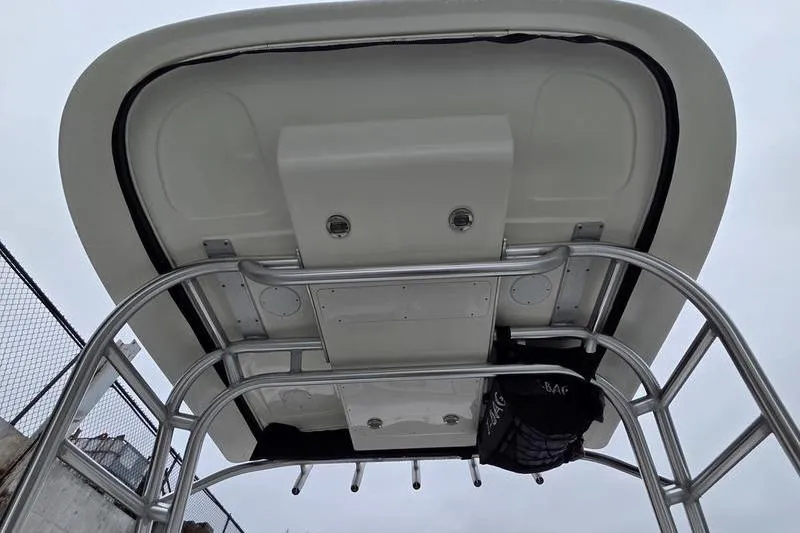 Slide: The Image of 2008 Sea Ray 290 Amberjack boat hardtop with metal framework, viewed from below. - 23