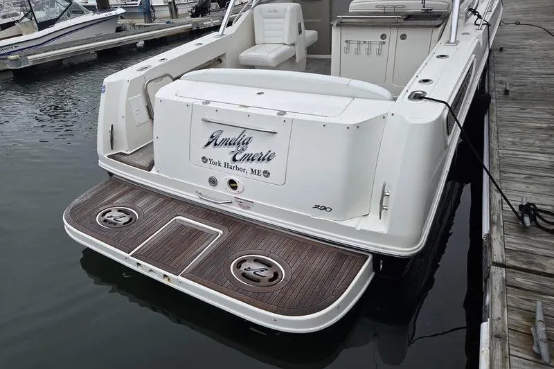 Slide: The Image of 2008 Sea Ray 290 Amberjack docked, featuring a spacious deck and comfortable seating. - 6