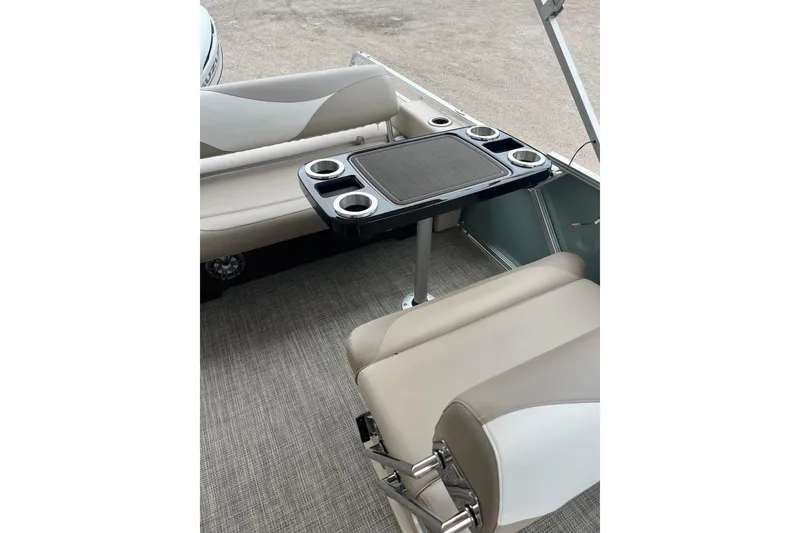 Slide: The Image of 2026 Tahoe 25 LTZ Entertainer boat interior with seating and table. - 4